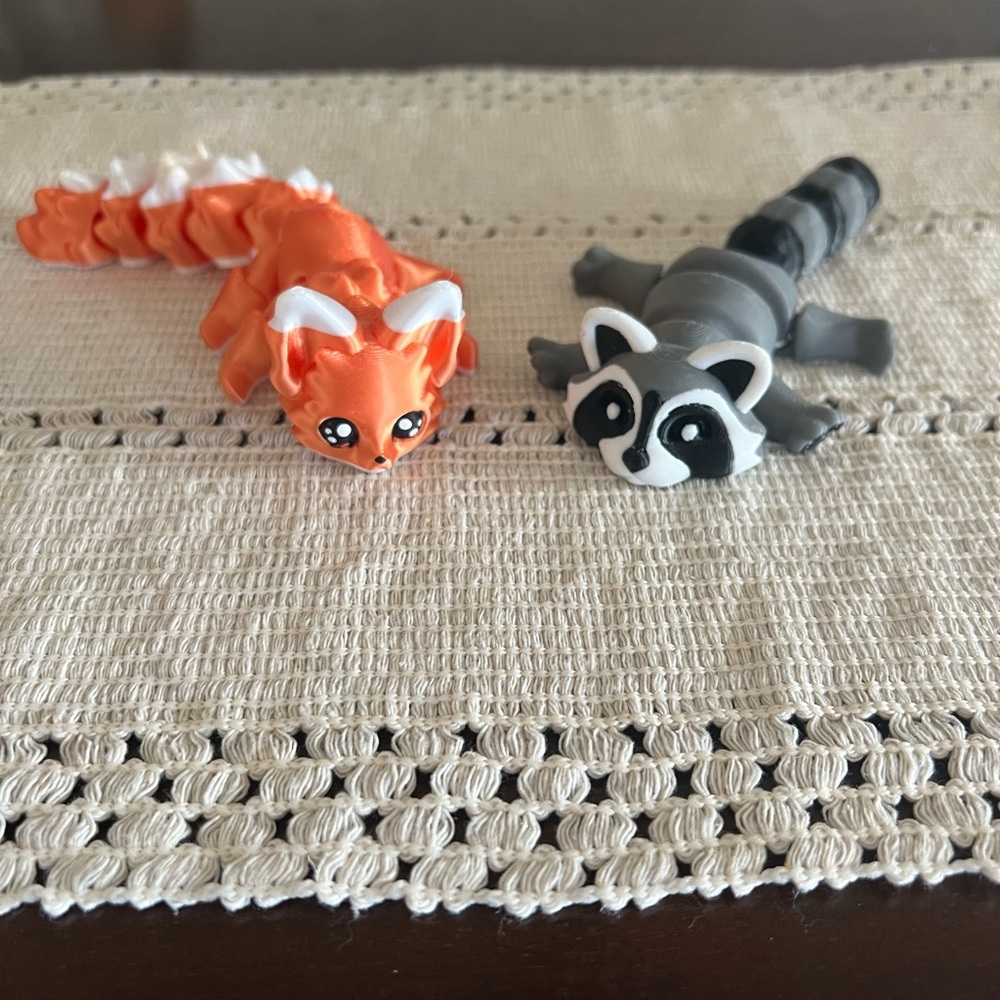 Cute Orange Fox and Gray Raccoon Figurines